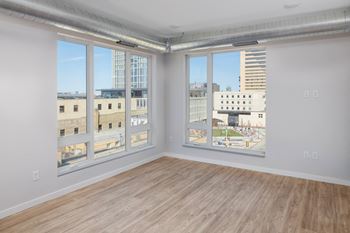 Large windows with view of cityscape at kesler apartments in downtown fargo, fargo, north dakota